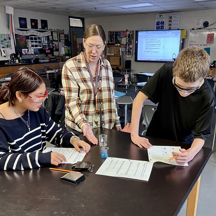 Johnson with students conducting a lab
